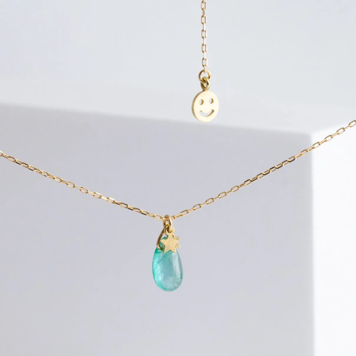 Emerald smiley necklace